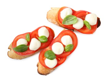 Photo of Tasty sandwiches with mozzarella cheese, tomatoes and basil on white background, top view