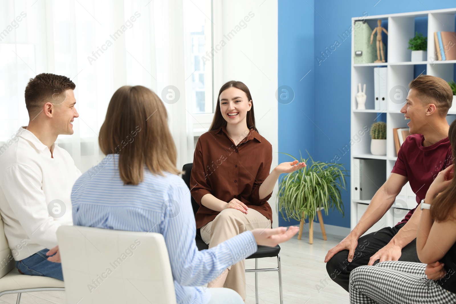 Photo of Group of people having meeting during life coaching class indoors