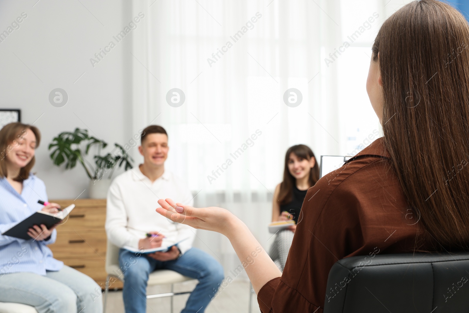 Group of people having meeting during life coaching class indoors, selective focus Photo of Group of people having meeting during life coaching class indoors, selective focus