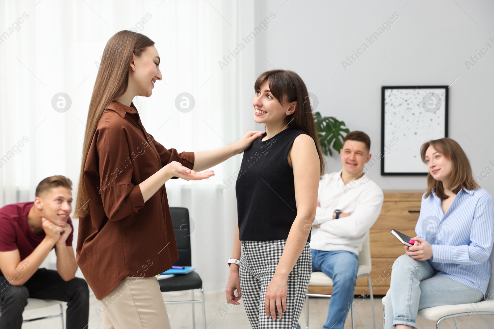 Group of people having meeting during life coaching class indoors Photo of Group of people having meeting during life coaching class indoors