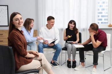 Photo of Group of people having meeting during life coaching class indoors