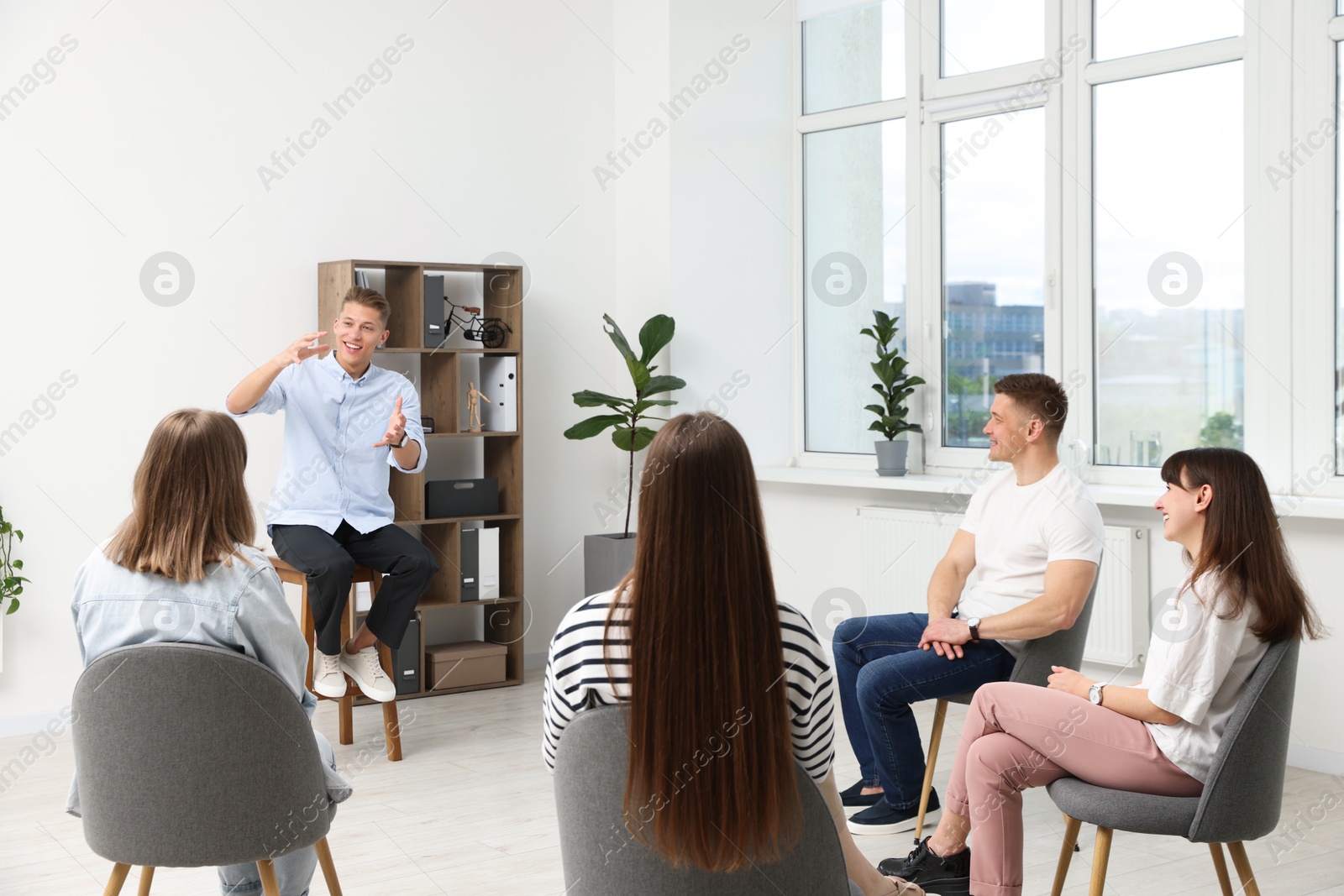 Group of people having meeting during life coaching class indoors Photo of Group of people having meeting during life coaching class indoors