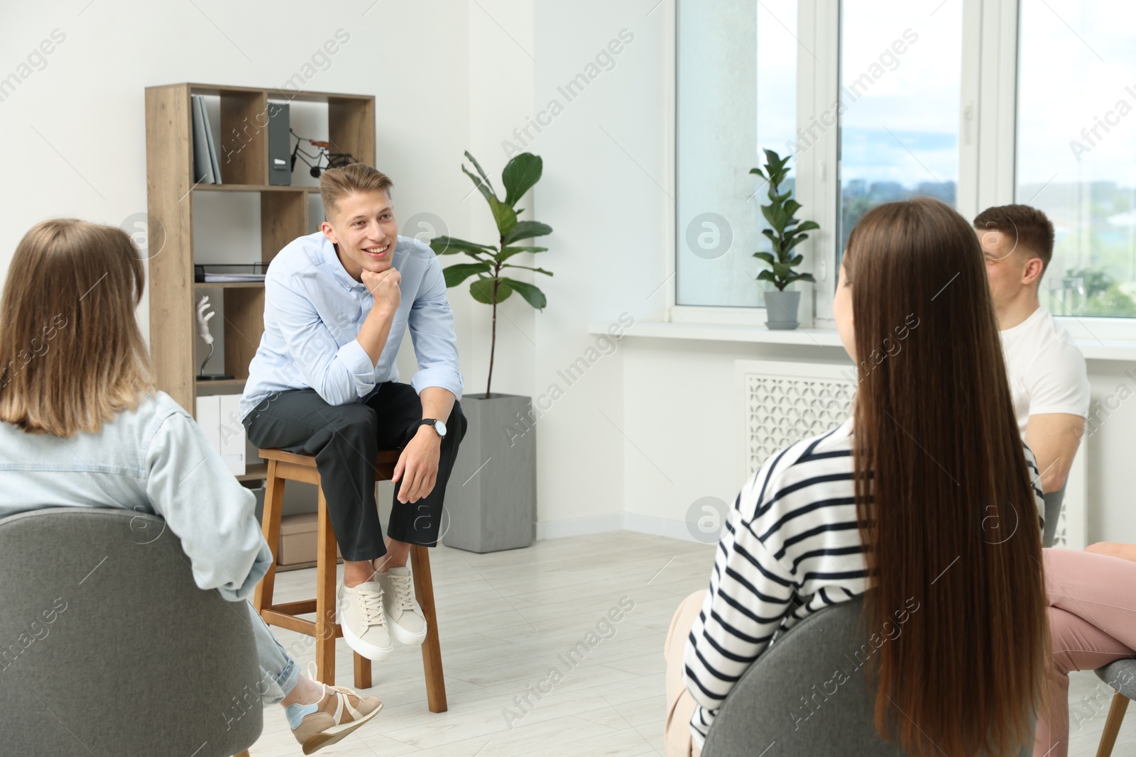 Photo of Group of people having meeting during life coaching class indoors