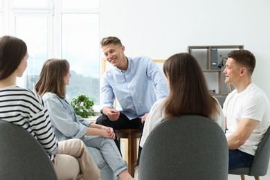 Photo of Group of people having meeting during life coaching class indoors