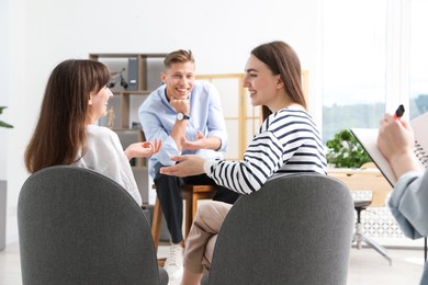 Photo of Group of people having meeting during life coaching class indoors