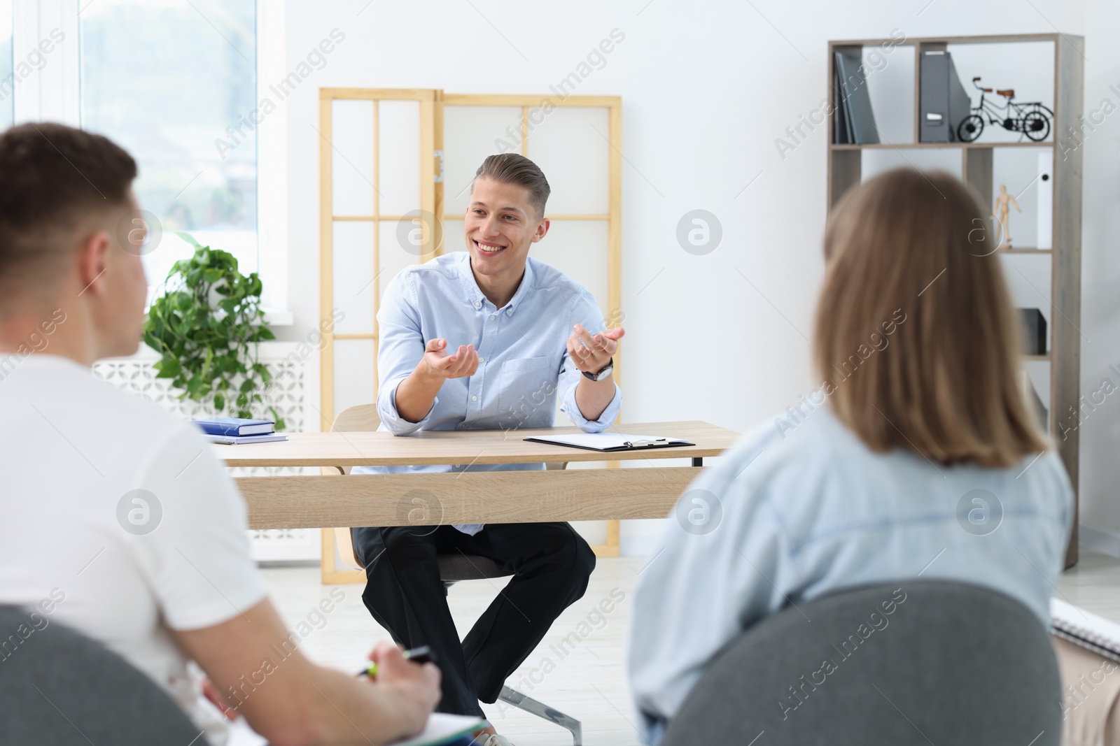 Photo of Group of people having meeting during life coaching class indoors