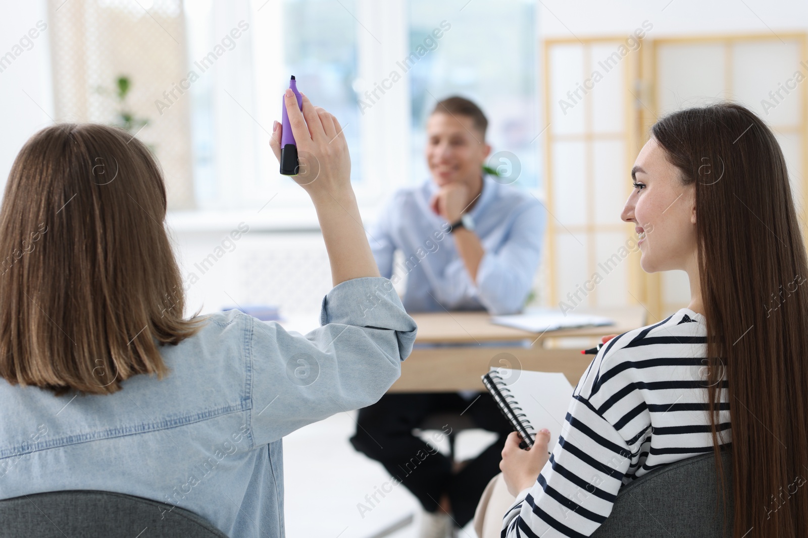 Photo of Group of people having meeting during life coaching class indoors, selective focus