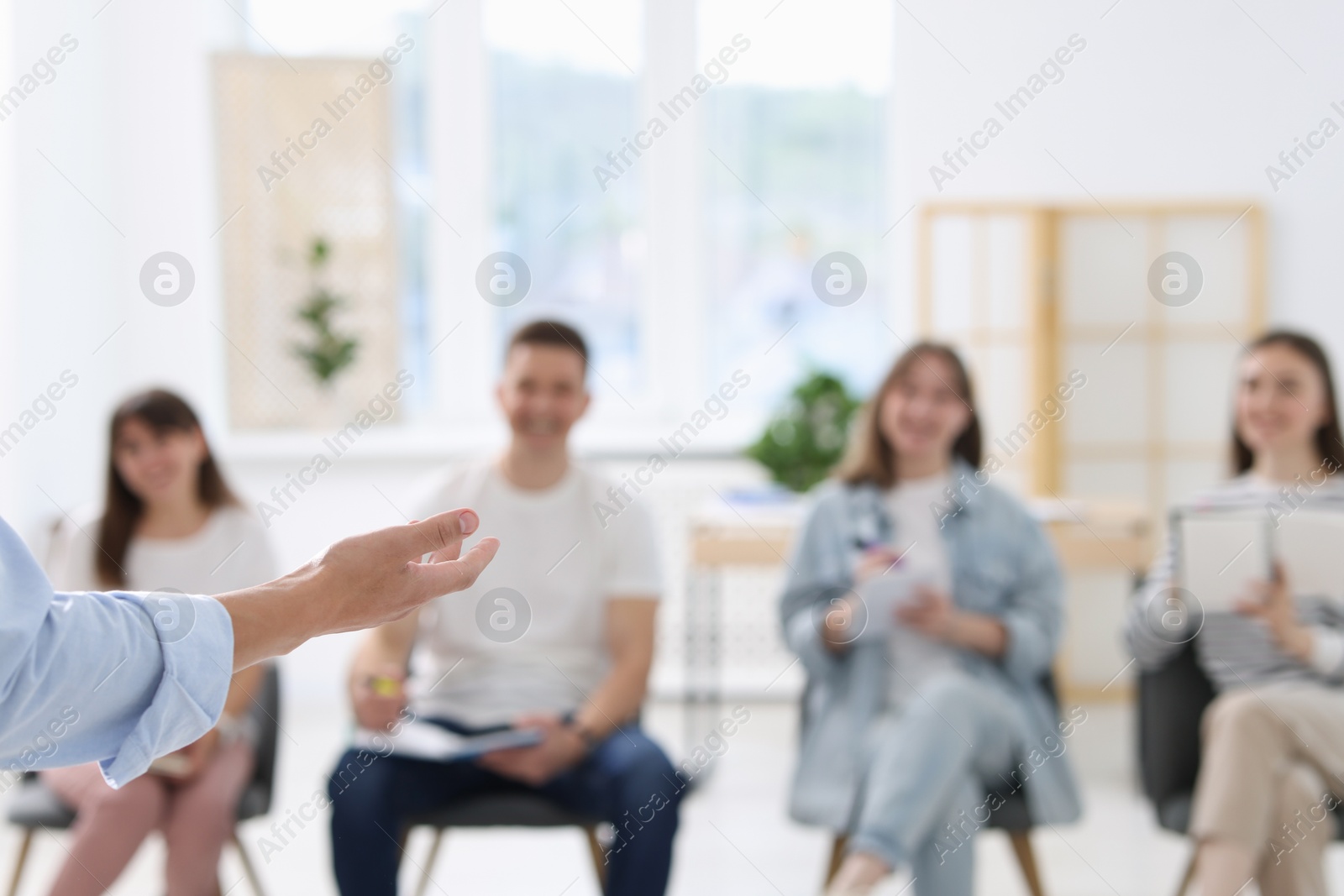 Group of people having meeting during life coaching class indoors, selective focus Photo of Group of people having meeting during life coaching class indoors, selective focus