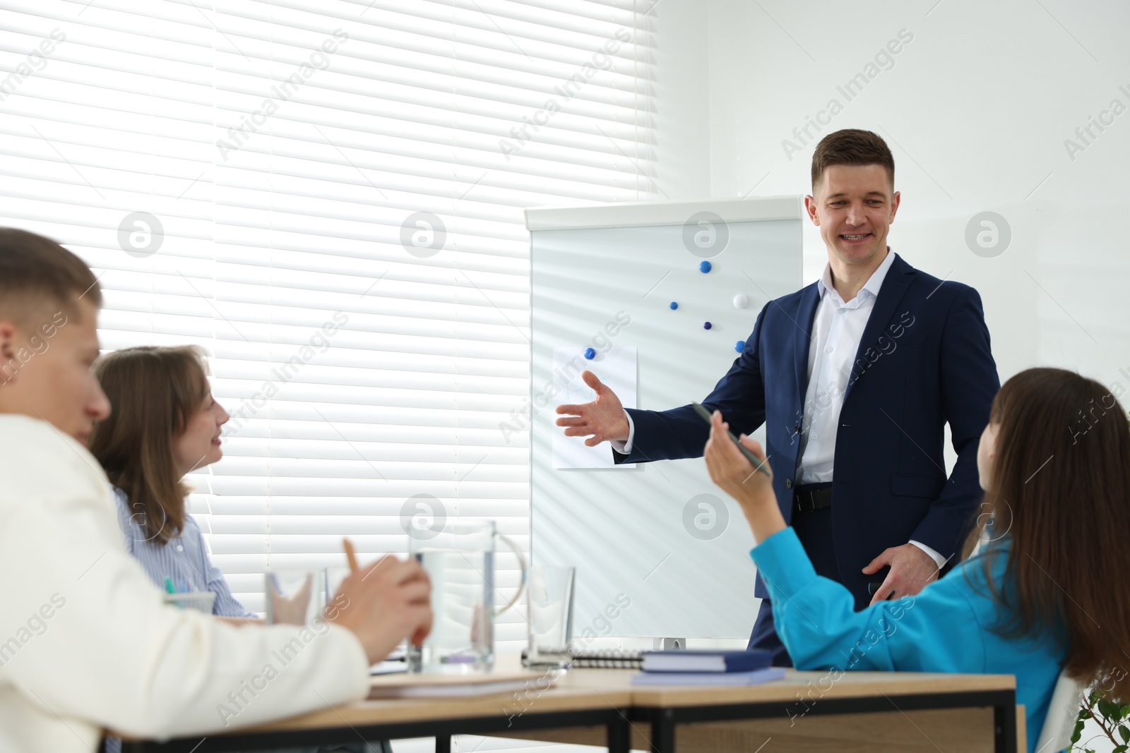 Photo of Group of people having meeting during life coaching class indoors
