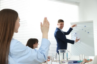 Photo of Group of people having meeting during life coaching class indoors, selective focus