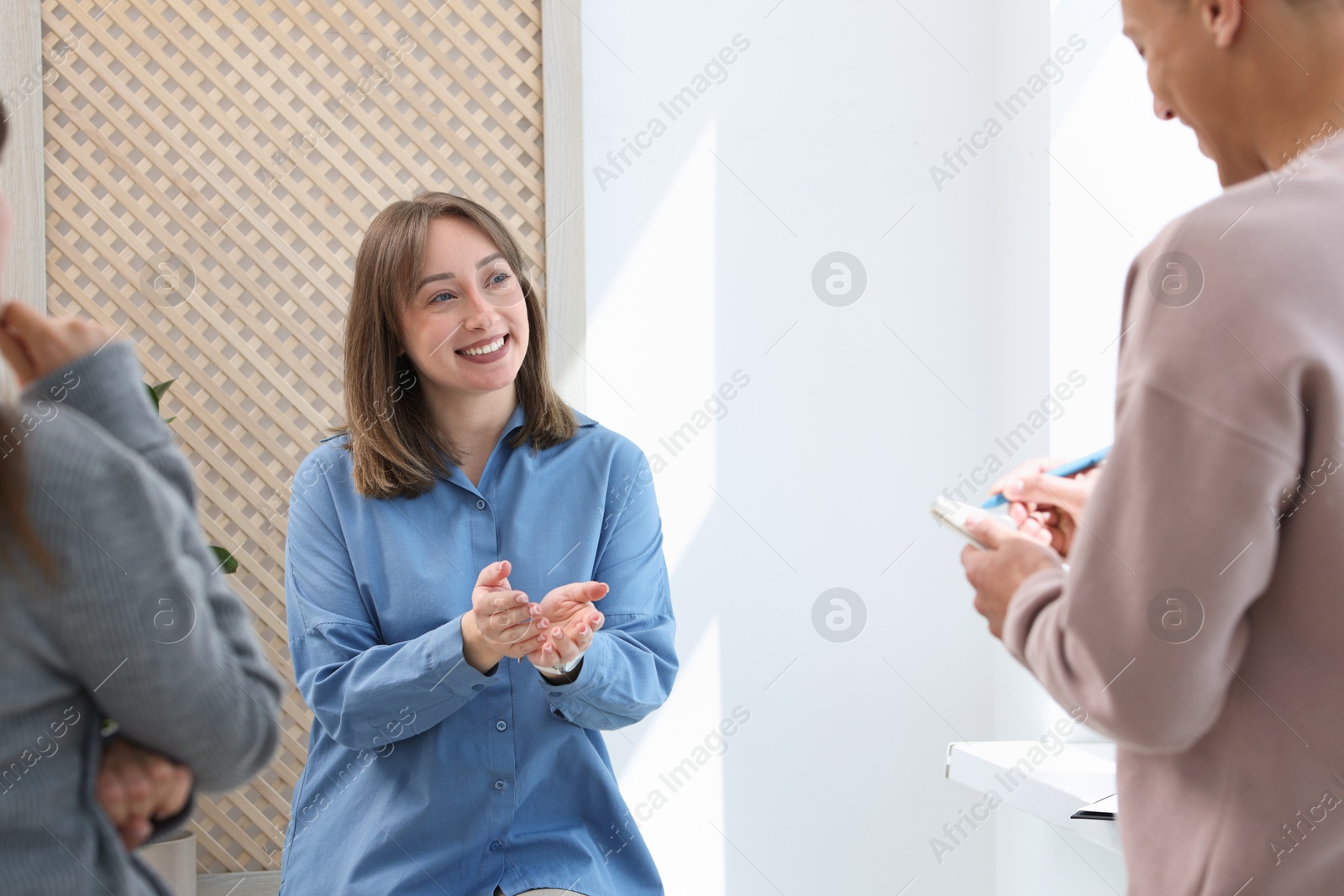 Photo of having meeting during life coaching class indoors