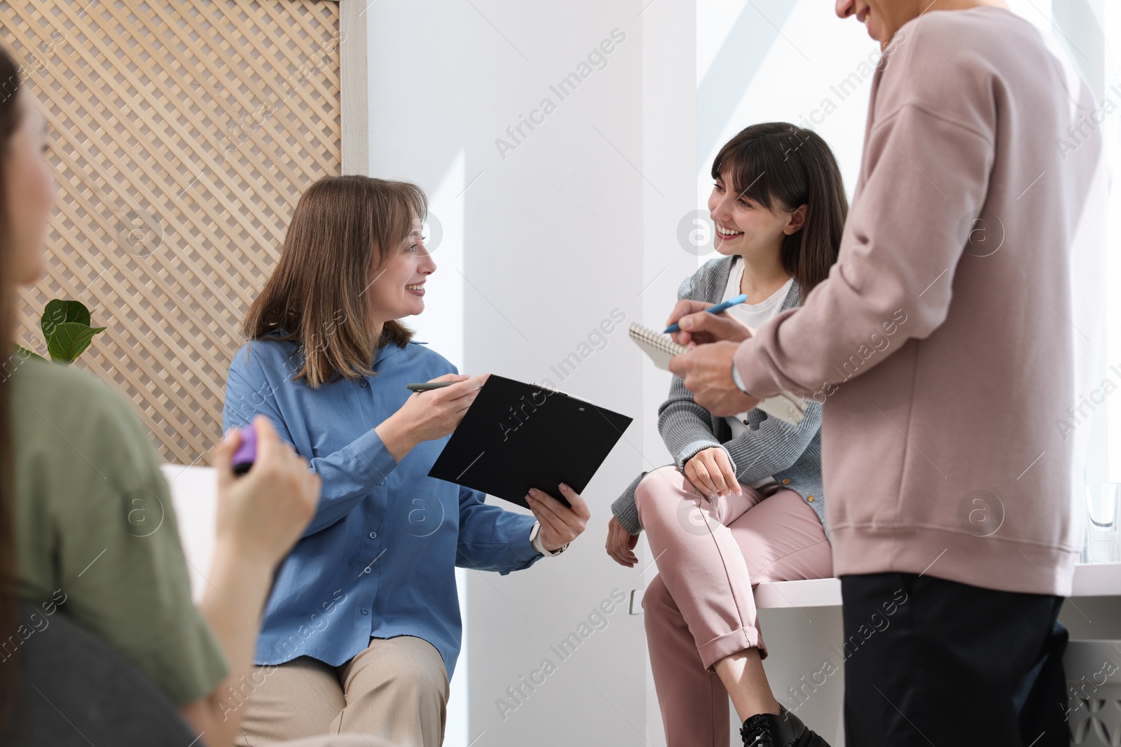 Group of people having meeting during life coaching class indoors Photo of Group of people having meeting during life coaching class indoors