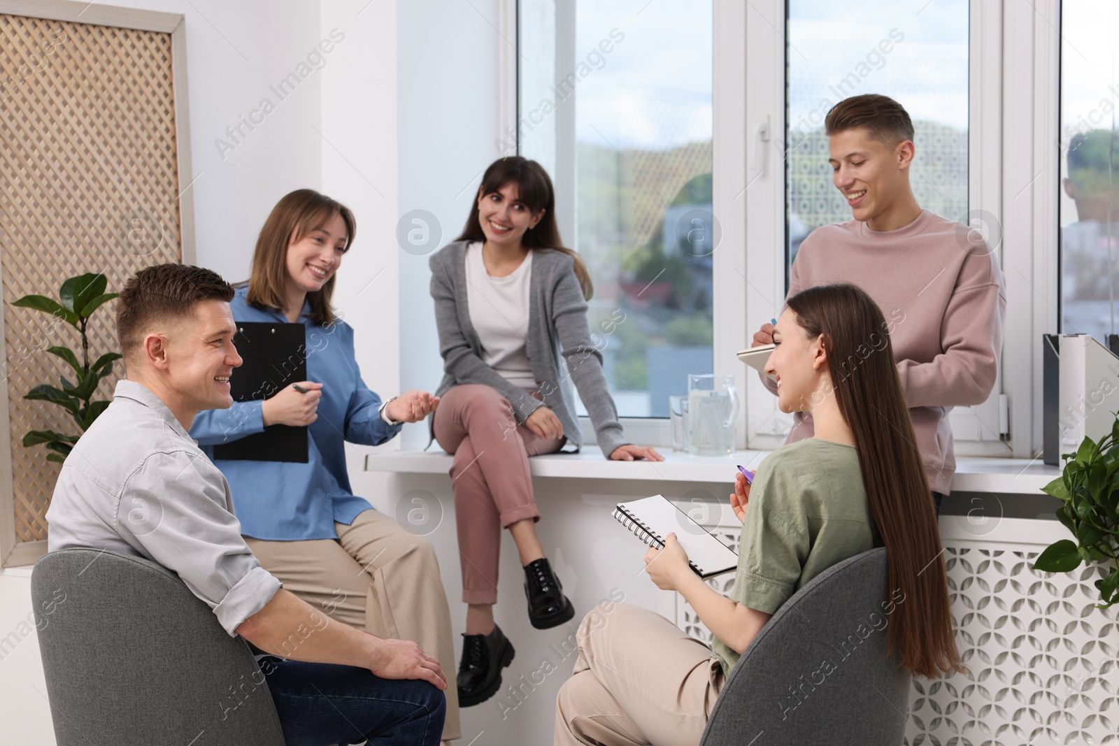 Group of people having meeting during life coaching class indoors Photo of Group of people having meeting during life coaching class indoors