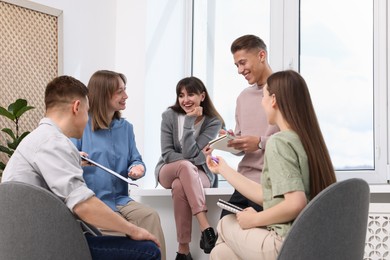 Photo of Group of people having meeting during life coaching class indoors
