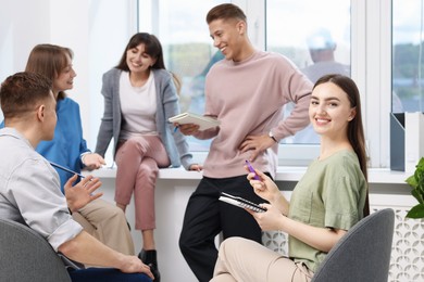 Photo of Group of people having meeting during life coaching class indoors
