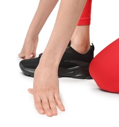 Photo of Runner in starting position on white background, closeup