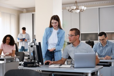 Photo of People studying together in library, selective focus