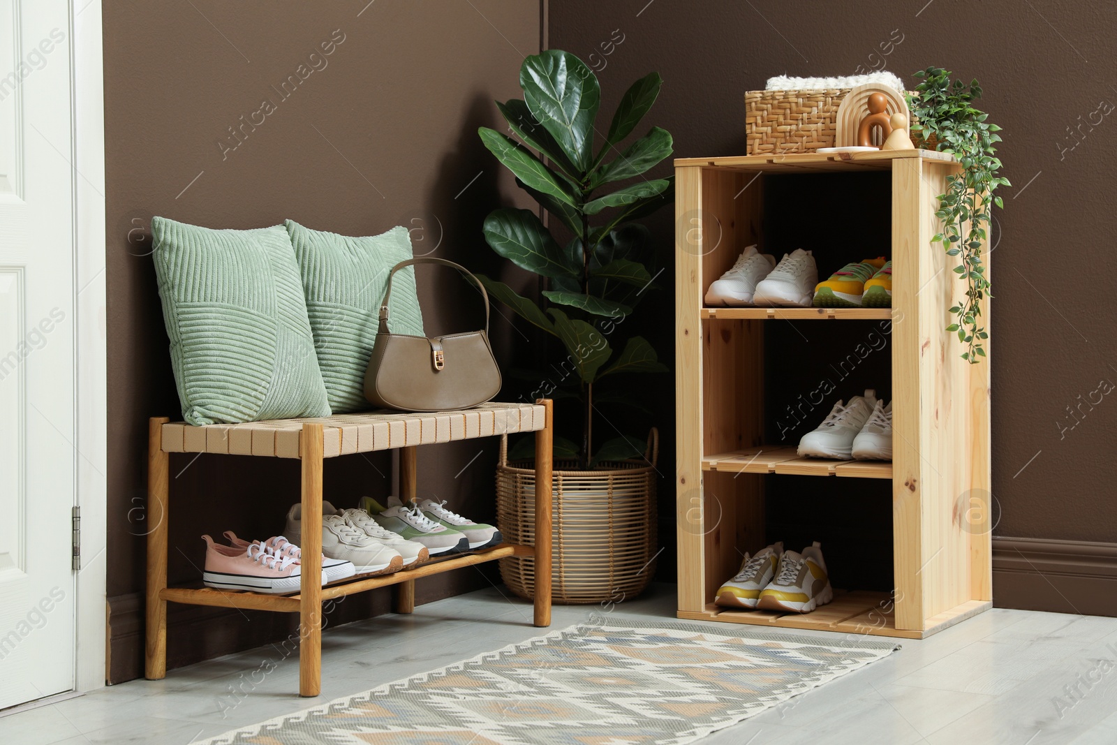 Different footwear on shelves in entryway. Shoe storage Photo of Different footwear on shelves in entryway. Shoe storage