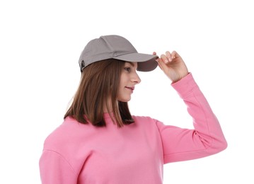 Photo of Young woman wearing stylish grey baseball hat on white background