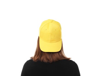 Photo of Young woman wearing stylish yellow baseball hat on white background, back view
