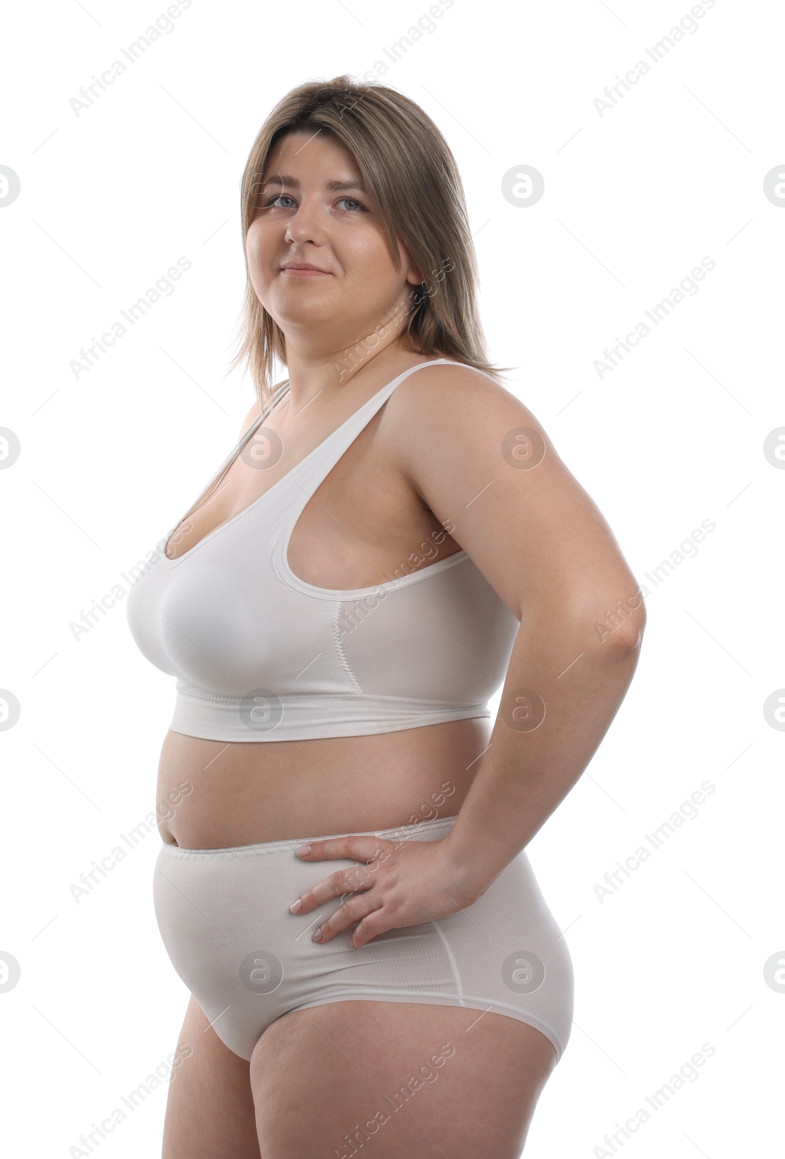 Photo of Weight loss. Plus size woman in underwear on white background