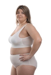 Photo of Weight loss. Plus size woman in underwear on white background