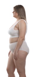 Photo of Weight loss. Plus size woman in underwear on white background