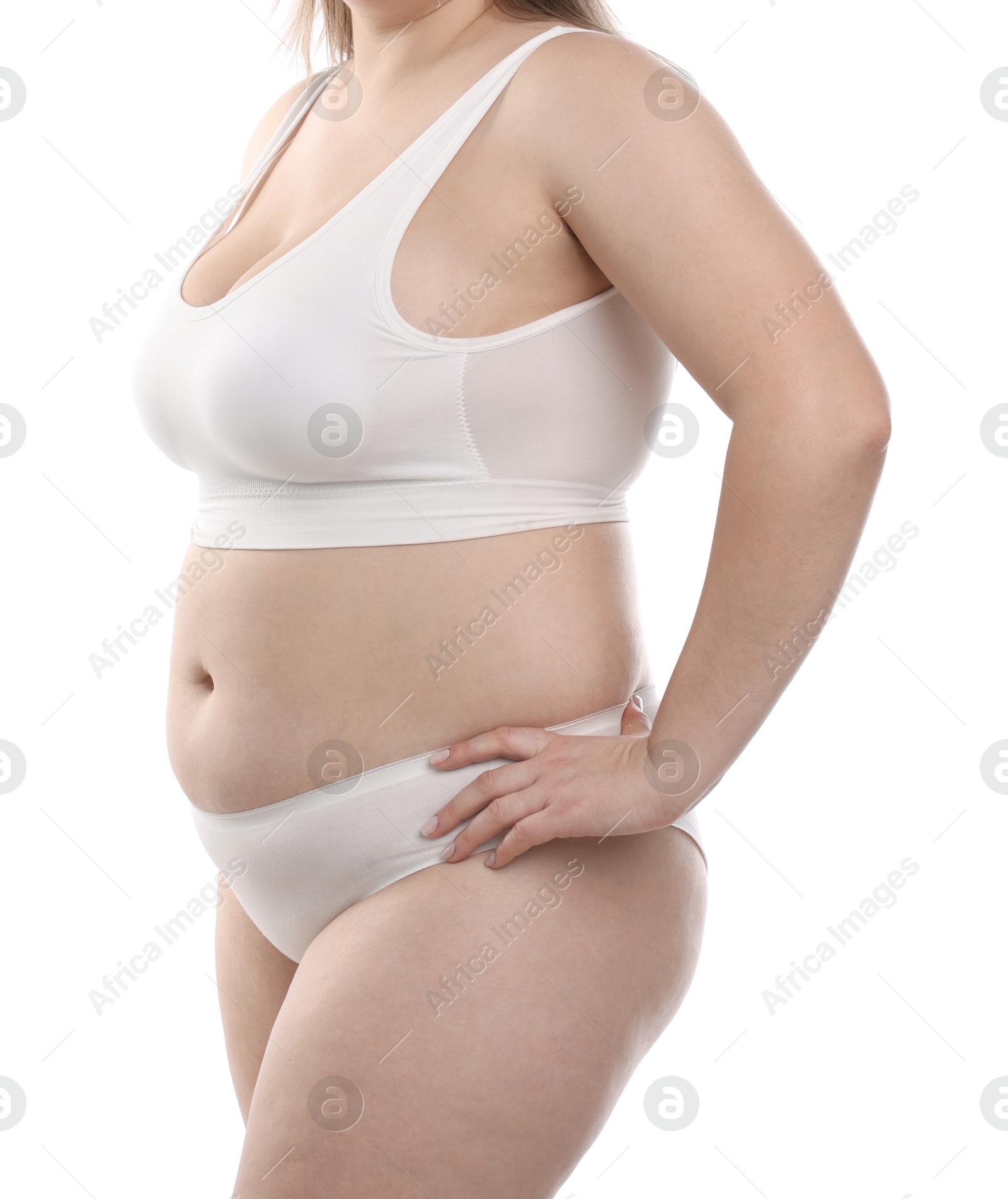 Weight loss. Plus size woman in underwear on white background, closeup Photo of Weight loss. Plus size woman in underwear on white background, closeup