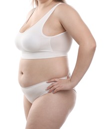 Photo of Weight loss. Plus size woman in underwear on white background, closeup