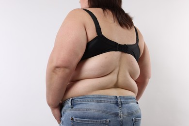 Photo of Overweight woman on white background, closeup view