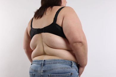 Photo of Overweight woman on white background, closeup view