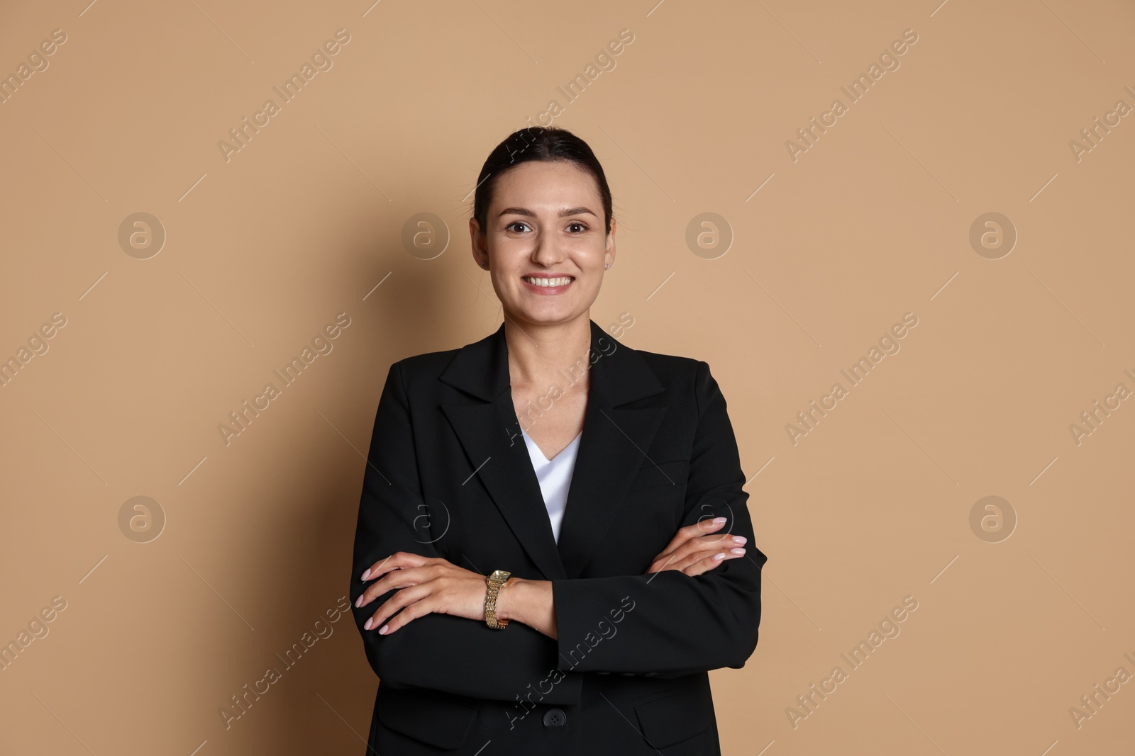 Photo of Confident business woman in suit on beige background