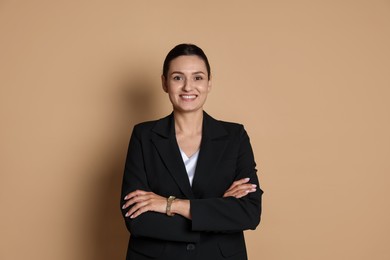 Photo of Confident business woman in suit on beige background