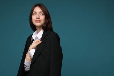 Photo of Beautiful woman in suit on light blue background, space for text