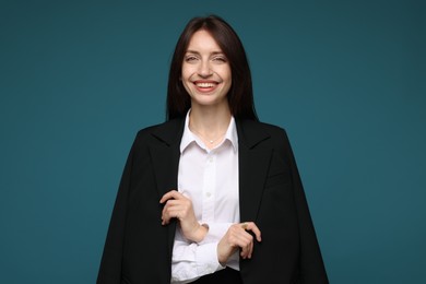 Photo of Happy woman in suit on light blue background