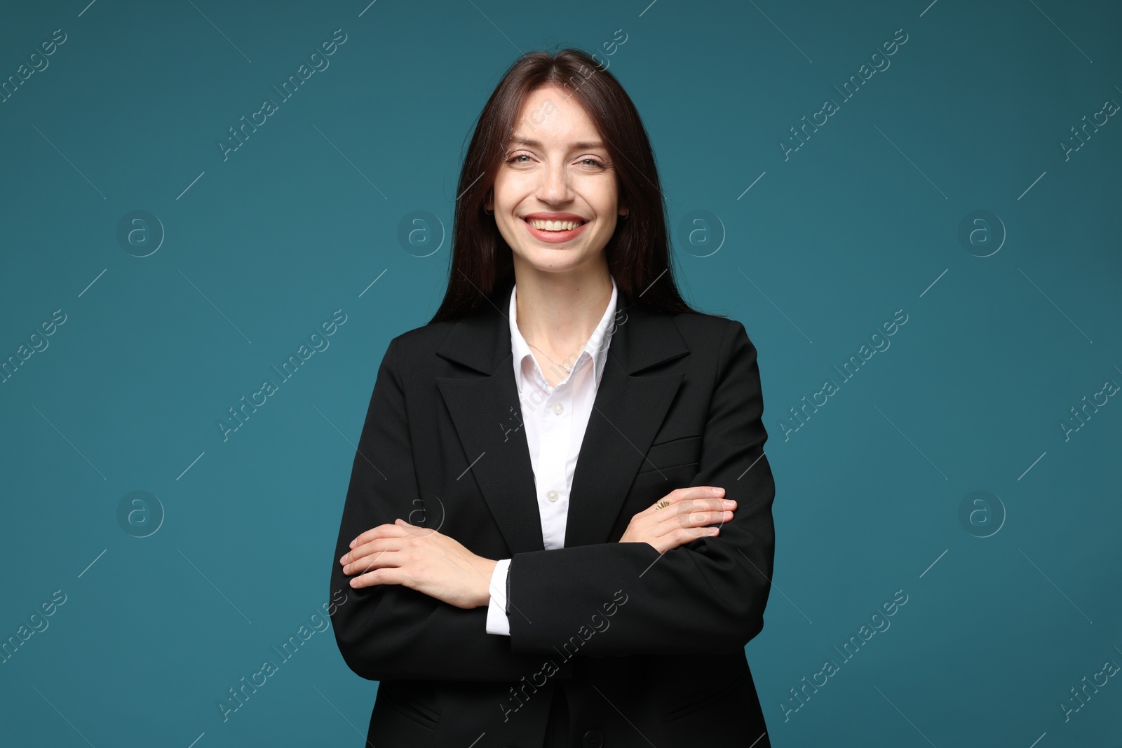 Photo of Happy woman in suit on light blue background
