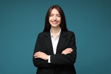 Photo of Happy woman in suit on light blue background