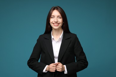 Photo of Happy woman in suit on light blue background