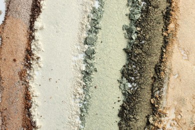 Photo of Colorful eyeshadows on white background, top view