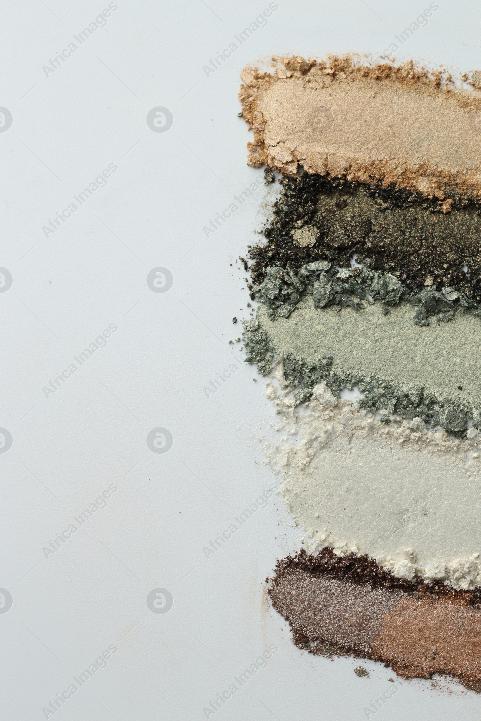 Colorful eyeshadows on white background, flat lay. Space for text Photo of Colorful eyeshadows on white background, flat lay. Space for text