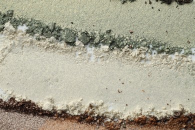 Photo of Colorful eyeshadows as background, top view. Cosmetic palette