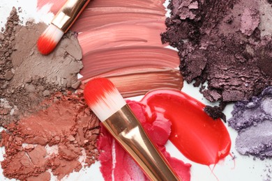 Photo of Different cosmetic products and makeup brushes on white background, flat lay