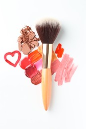 Photo of Different cosmetic products and makeup brush on white background, flat lay