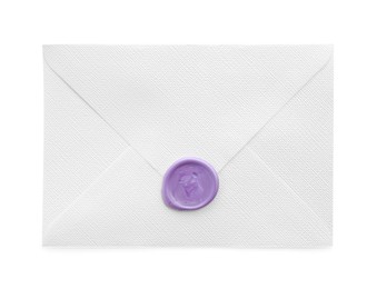 Photo of Beautiful invitation envelope with wax seal isolated on white, top view