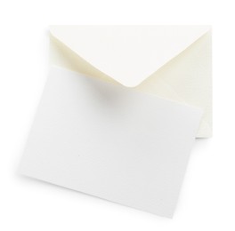 Photo of Blank invitation card and envelope isolated on white, top view. Space for design