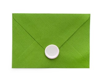 Photo of Beautiful invitation envelope with wax seal isolated on white, top view