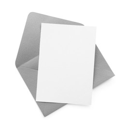 Photo of Blank invitation card and envelope isolated on white, top view. Space for design