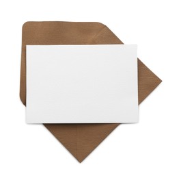 Photo of Blank invitation card and envelope isolated on white, top view. Space for design