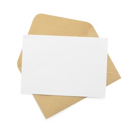 Photo of Blank invitation card and envelope isolated on white, top view. Space for design