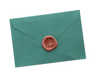 Photo of Beautiful invitation envelope with wax seal isolated on white, top view